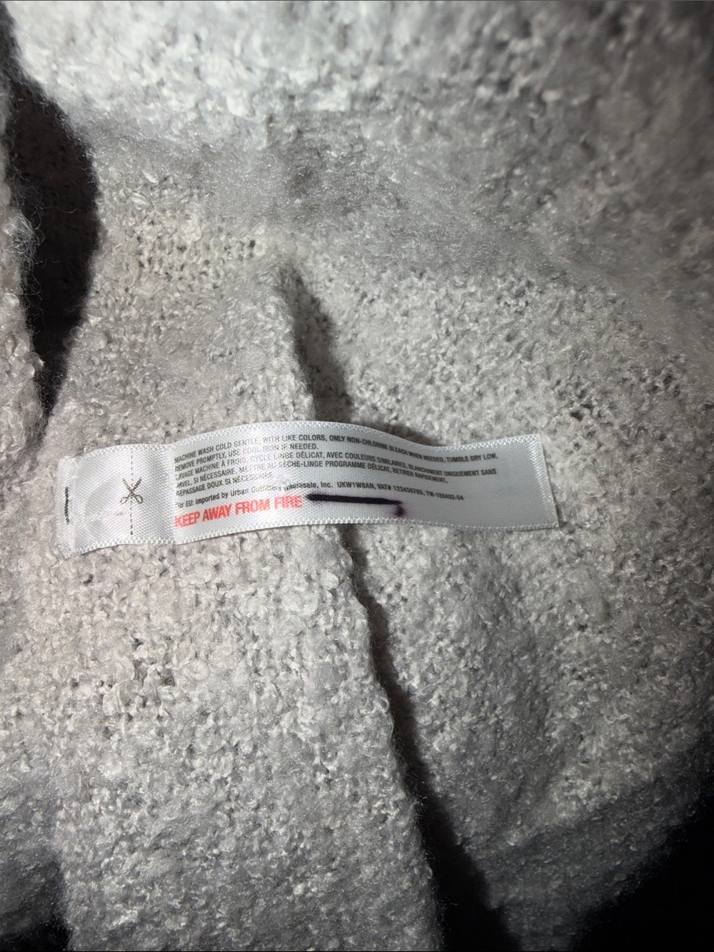 New Light grey knitted shawl scarf with a distinctive fringe detail at the hem. - Picture 2 of 3